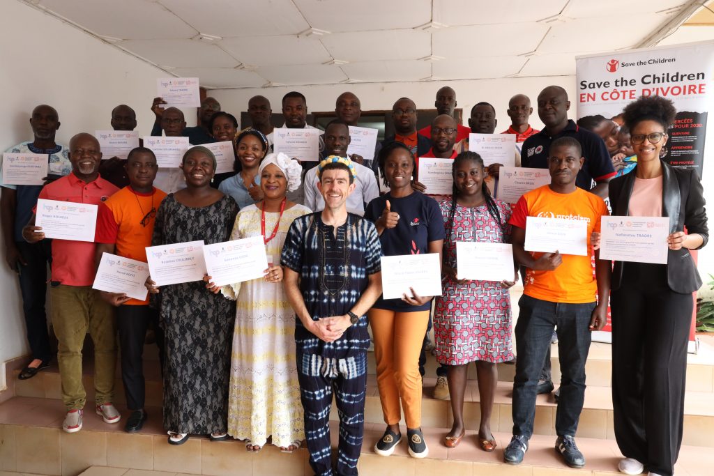 group photo of people with certificates