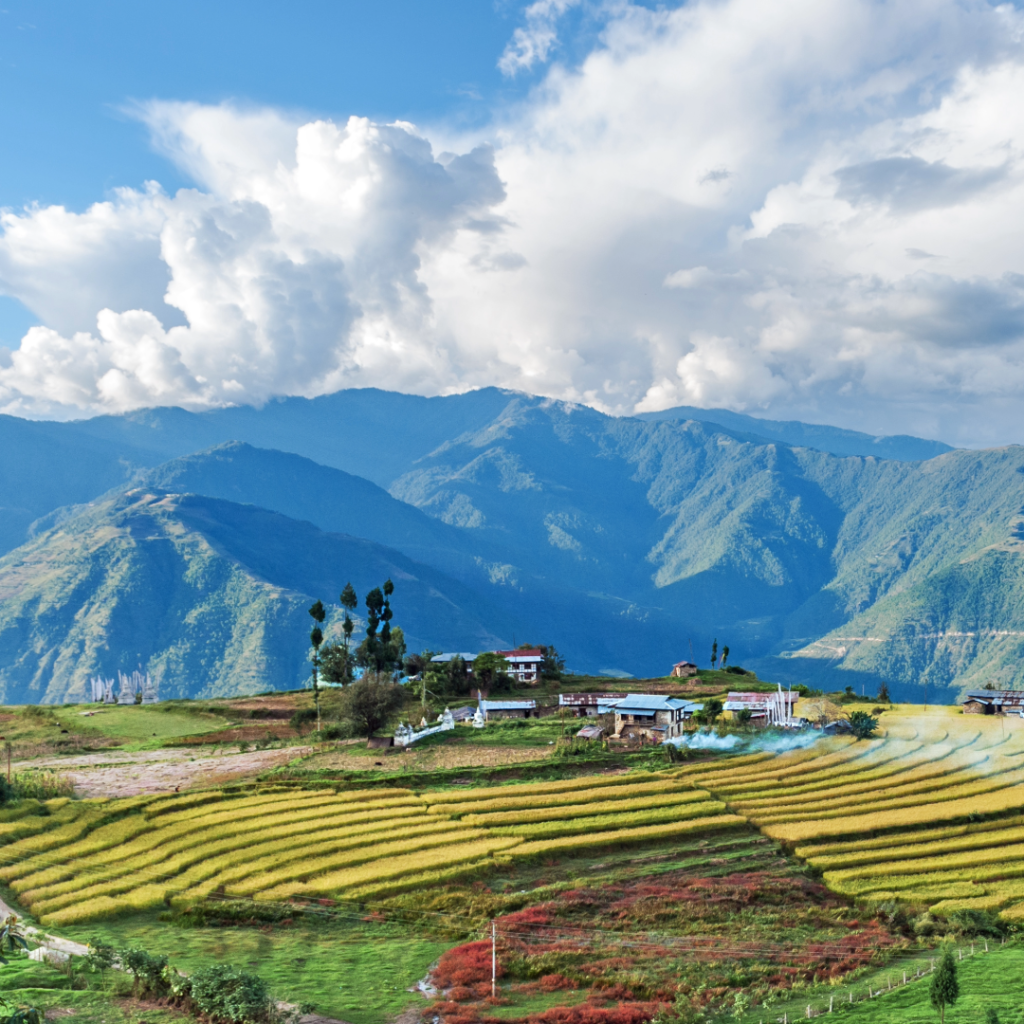 View of mountain range and farms in Bhutan